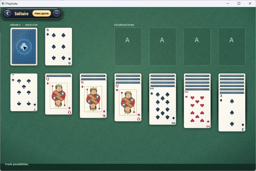 A Klondike deal on green felt with cream playing cards and suit foundations.